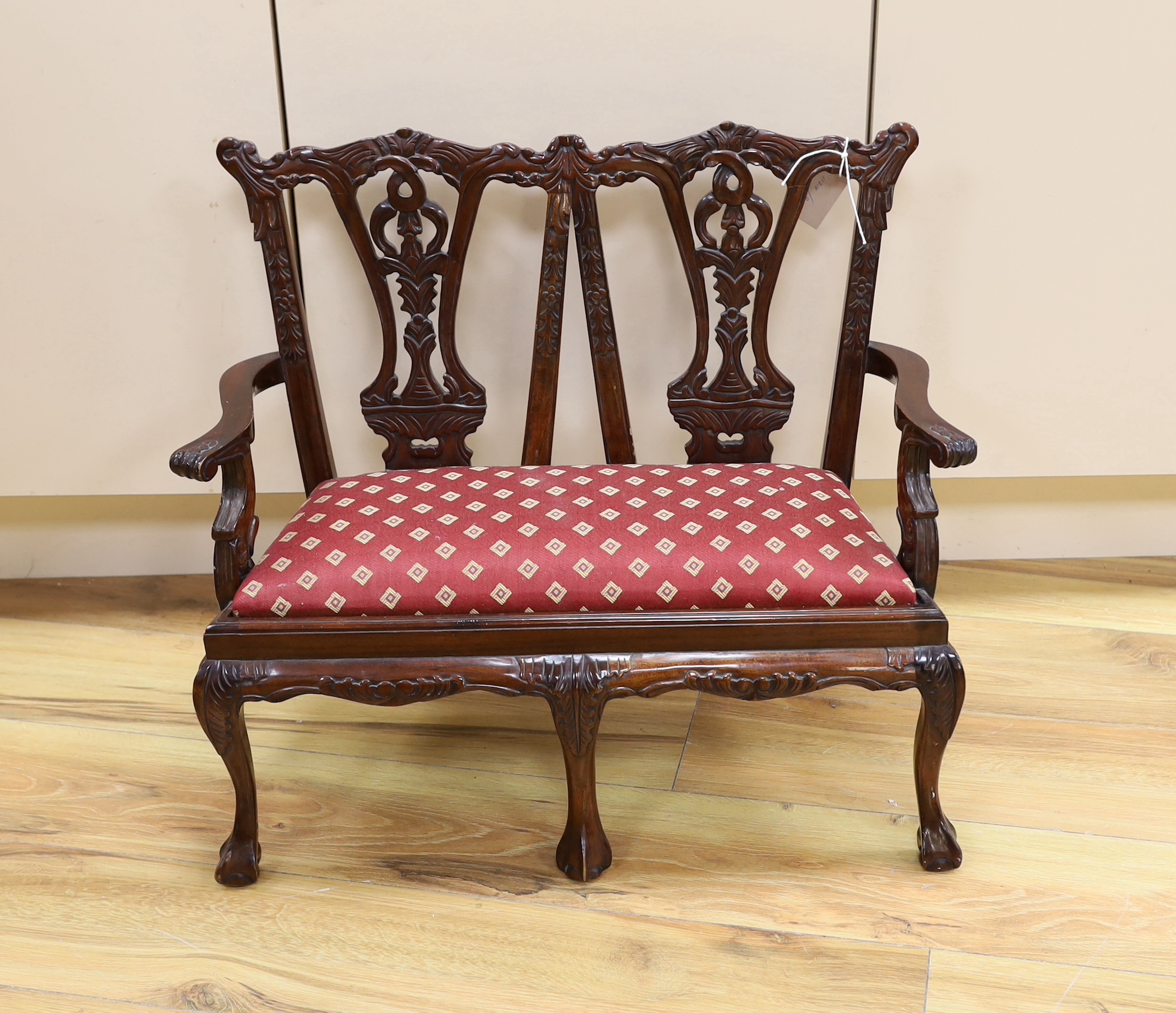 A miniature Chippendale style chair back settee, 51.5cm high